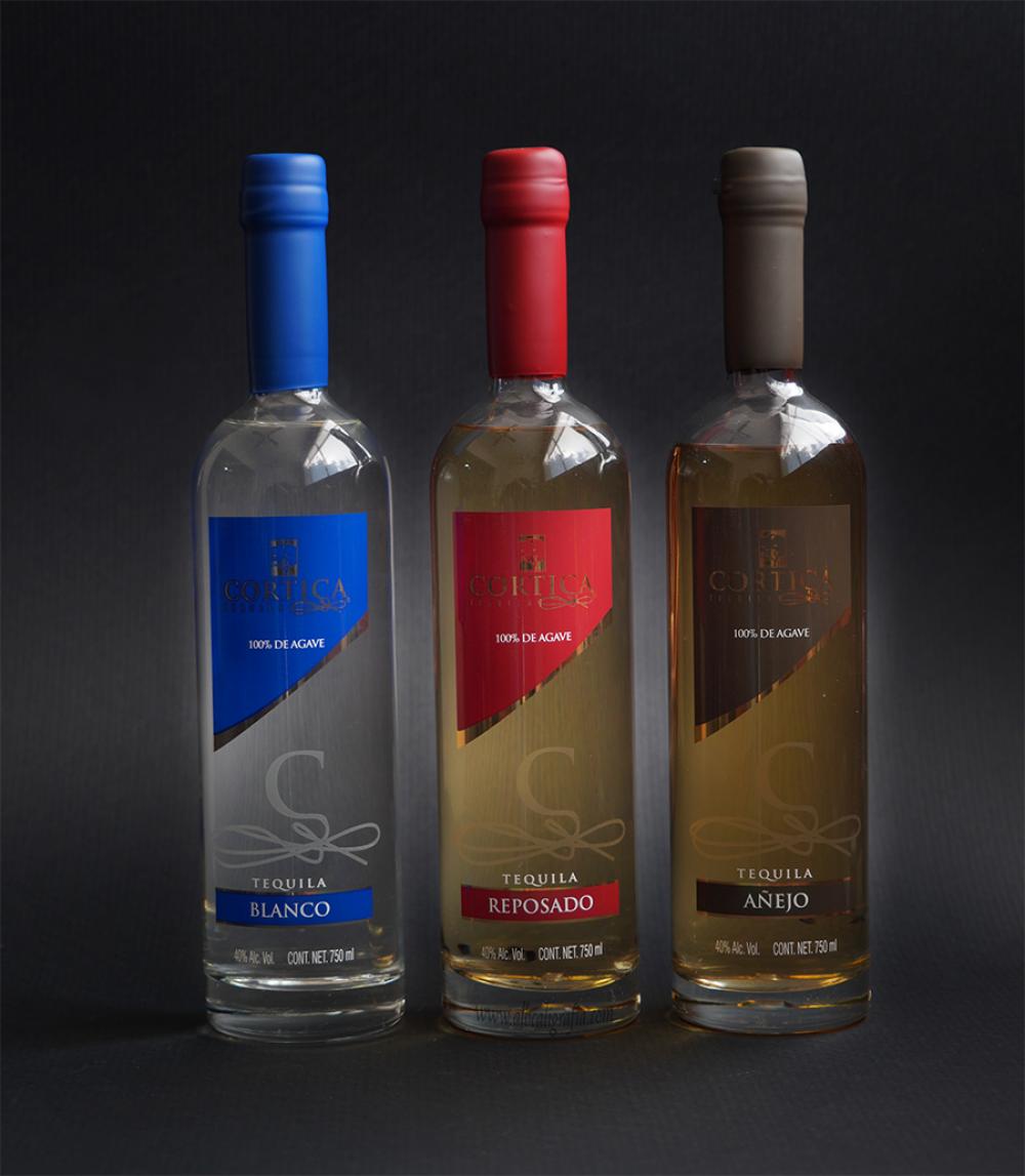 3 wax dipping bottles of CORTICA tequila, the color the wax match whit the color of the label