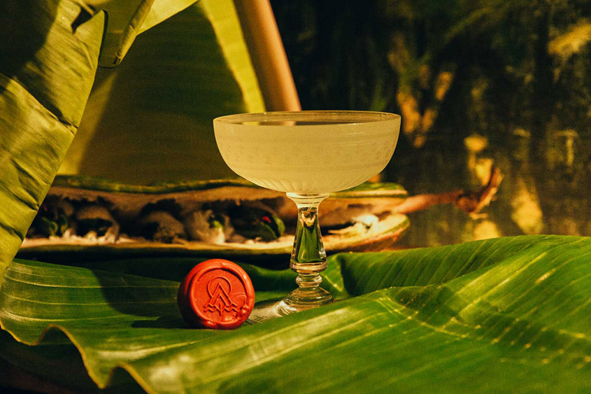 Cocktail made with The Lost Explorer Mezcal, and the bottle cap with red sealing wax and their logo stamped