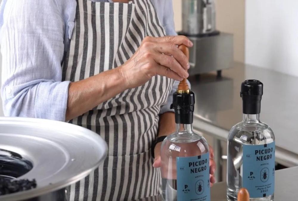 Sealed with black wax on the top of the bottles