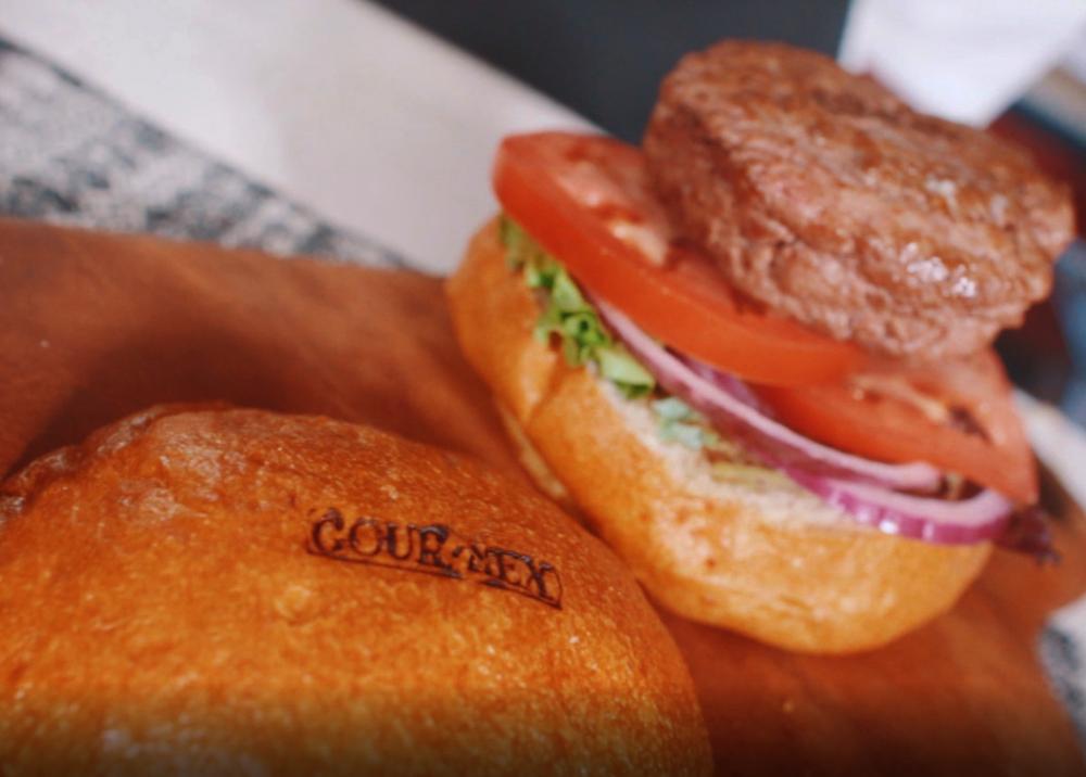 Hamburger with the brand stamped on bread