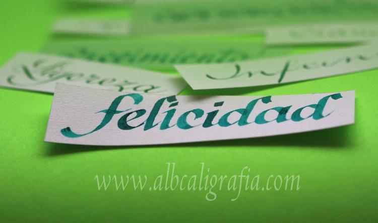 Word happiness written in calligraphy on a green background