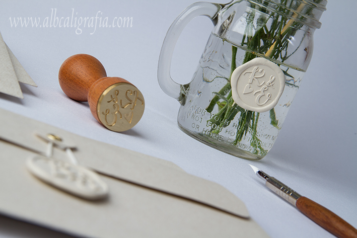 Sealed jar with flowers in ivory, sealing wax seal and calligraphic pen