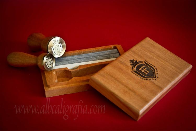 Sealing wax set that includes seals, silver and ivory sealing wax  and wooden box engraved with a shield