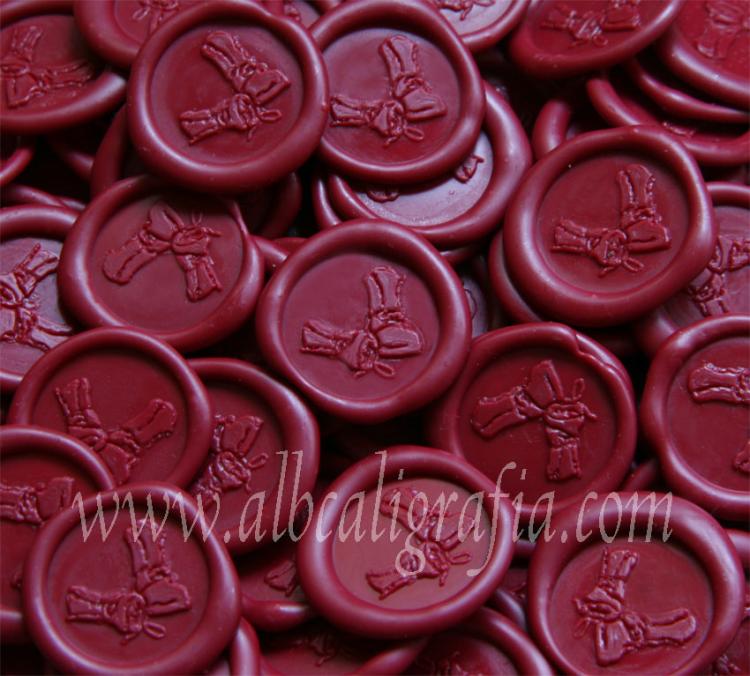 Sealing wax medallions in red color for wine bottles