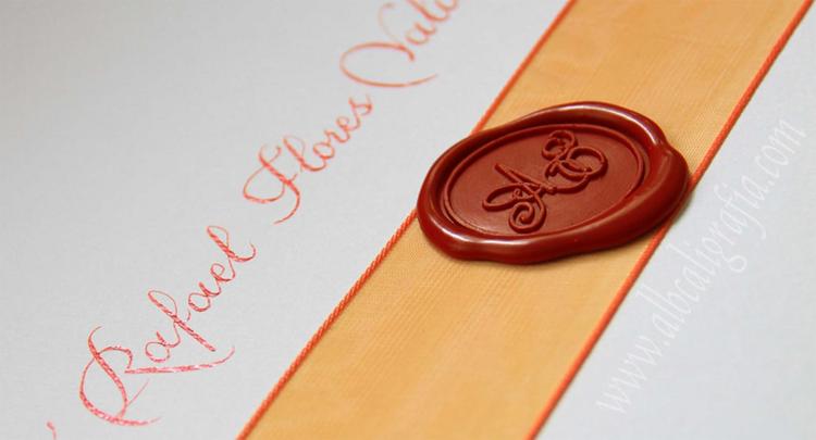 Invitation with red seling wax, decoration ribbon and calligraphy in orange color