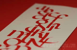 Alphabet in red in calligraphic style