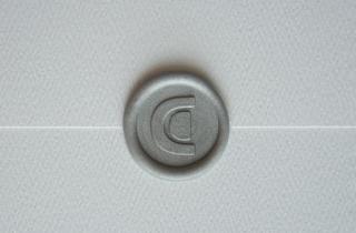 Sealed white envelope with CD logo in silver color