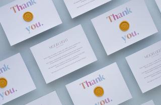 Thank you cards with a sealing wax sticker of happy face in yellow