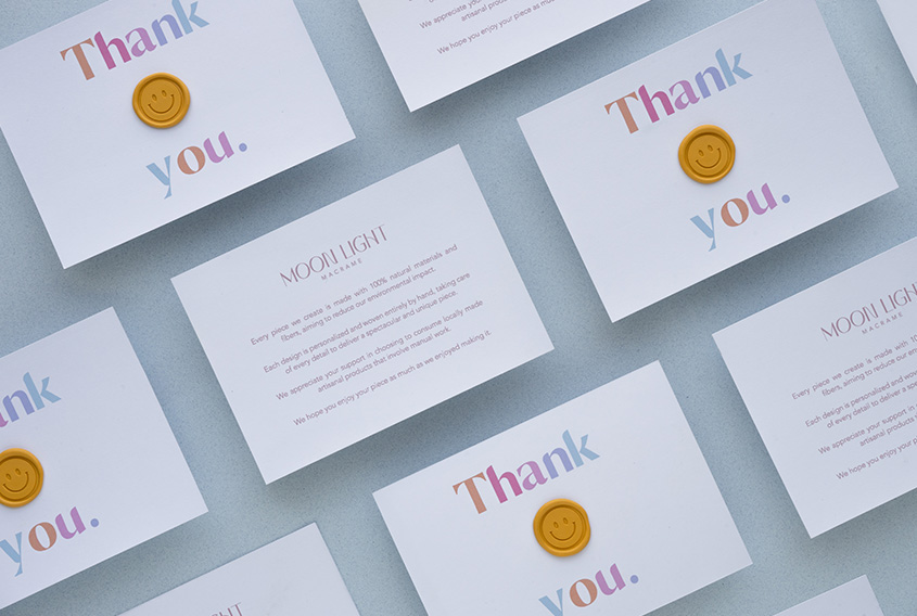 Thank you cards with a sealing wax sticker of happy face in yellow