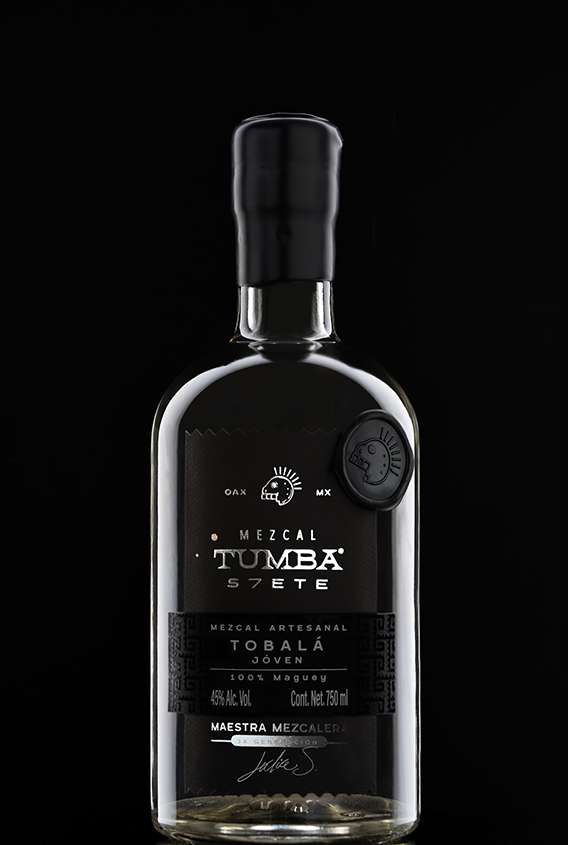 Tumba 7 Mezcal bottle with our black sealing wax in the neck of the bottle and a sealing wax sticker with their logo on the top right side of the labe